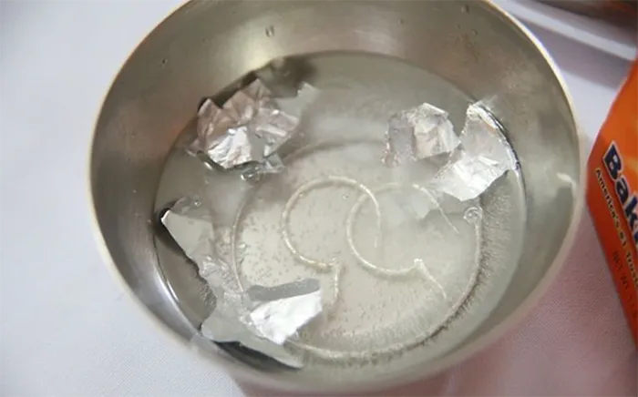 Cleaning silver with baking soda.