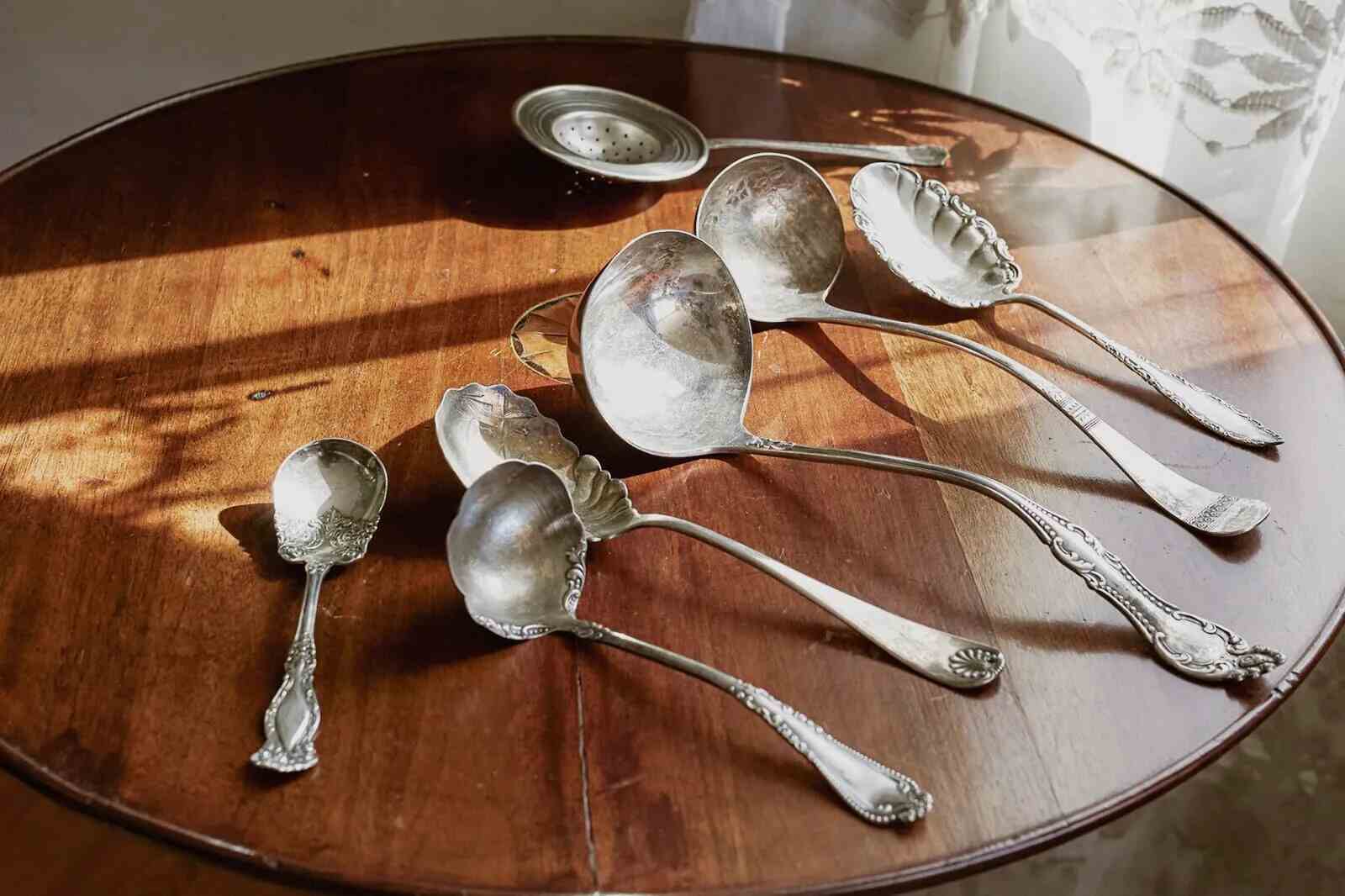antique Silver Cutlery on a wooden table