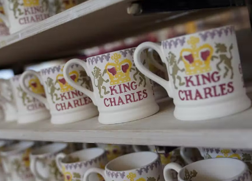 rows of mugs that read King Charles