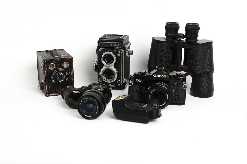 vintage cameras and binoculars