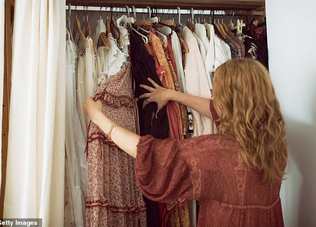 woman looking through wardrobe